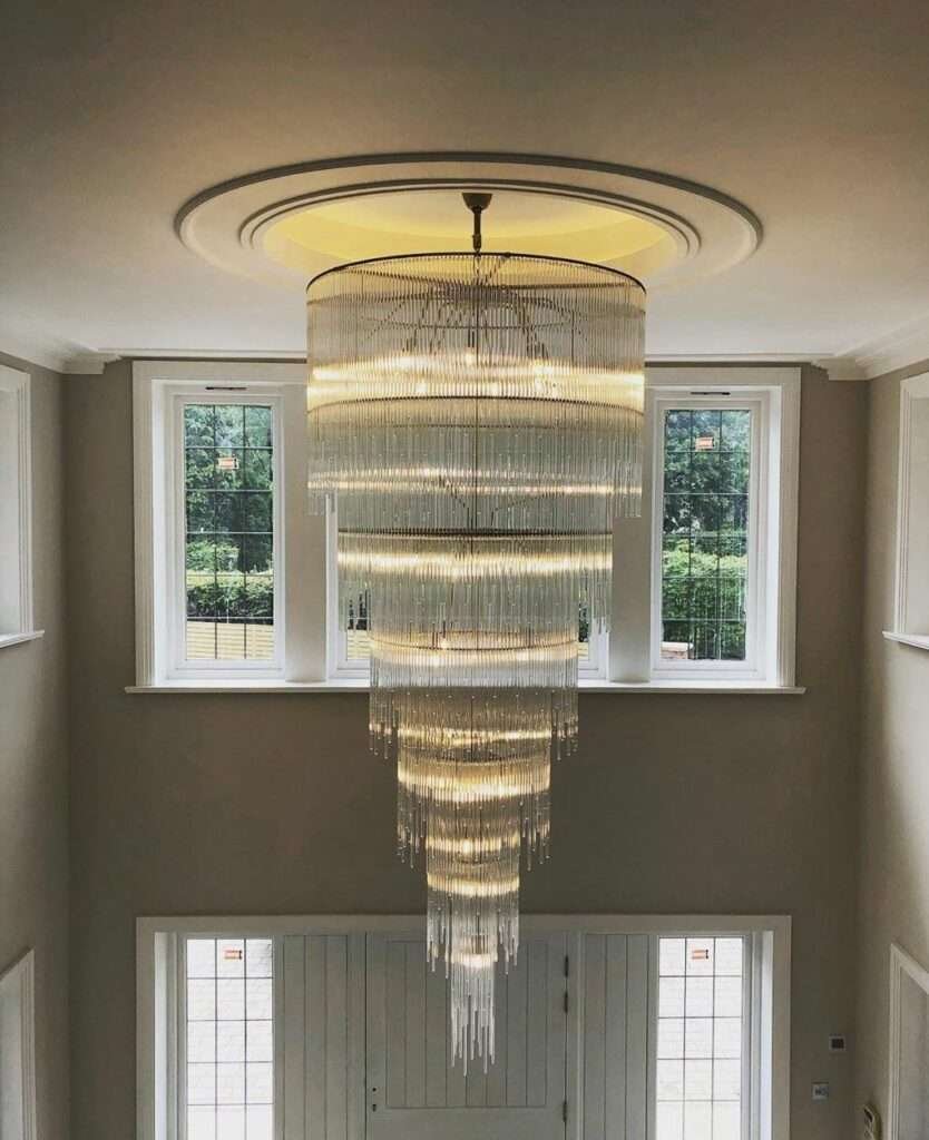 Elegant double-height chandelier lighting