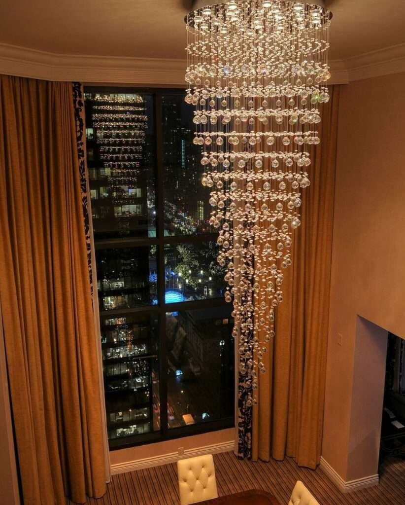 Elegant double-height chandelier lighting