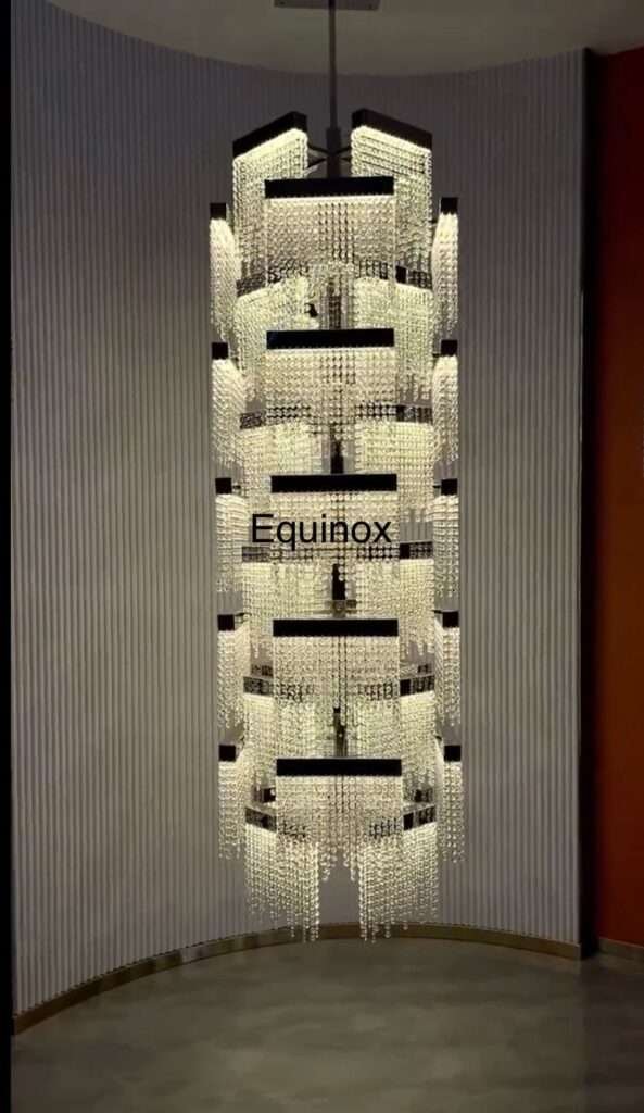 Elegant double-height chandelier lighting