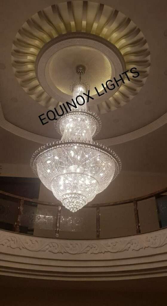 Elegant double-height chandelier lighting