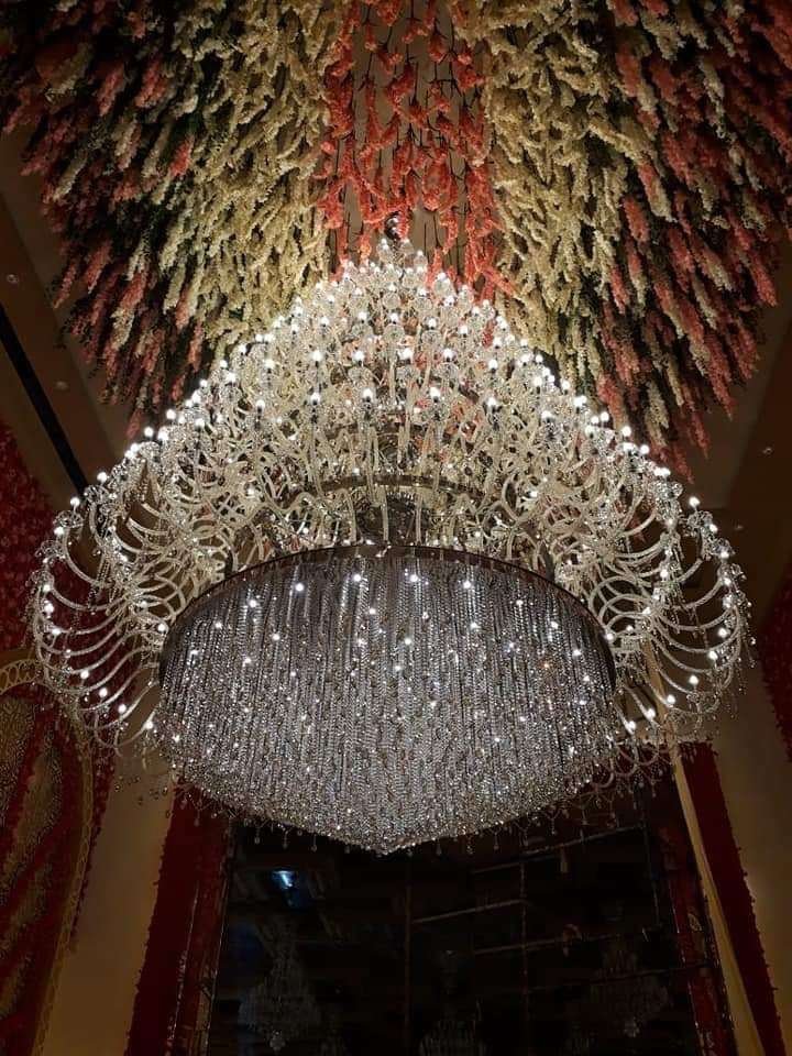 Elegant double-height chandelier lighting